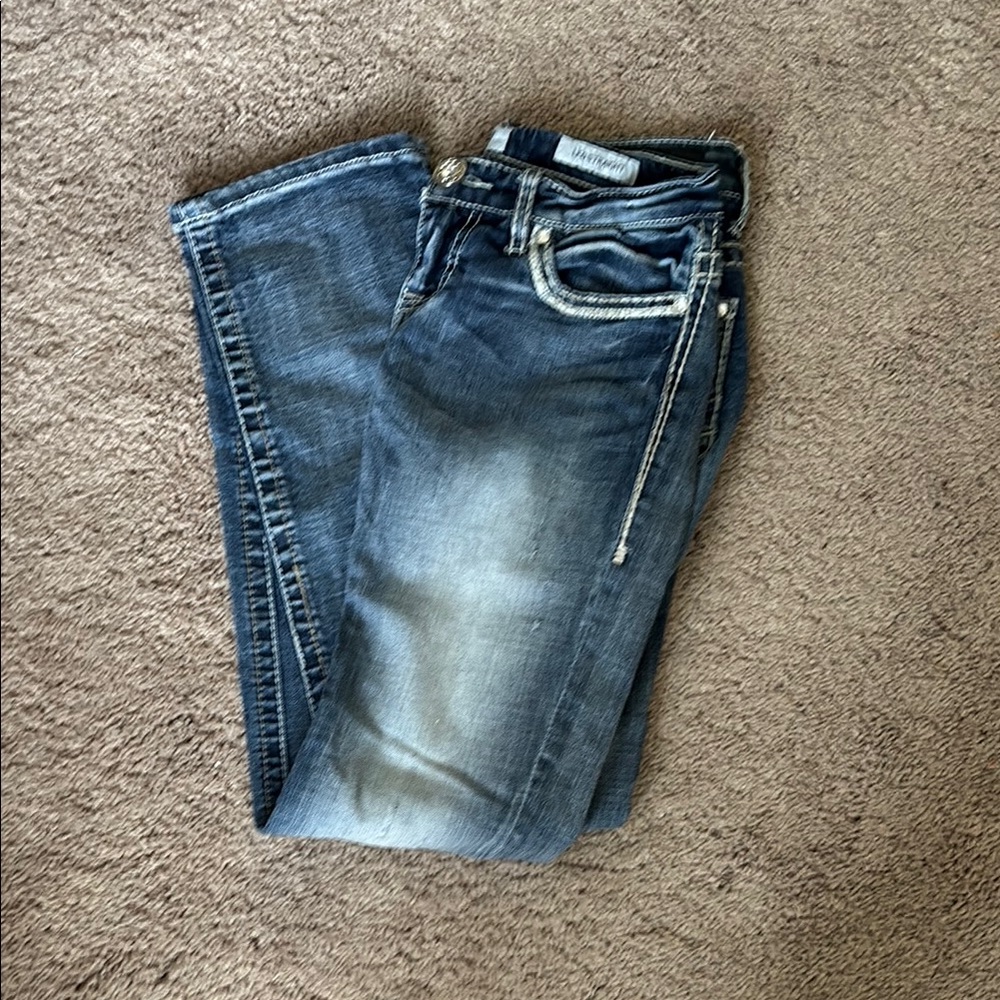 Blue Skinny Jeans with Whiskering Effects and Distressed Details